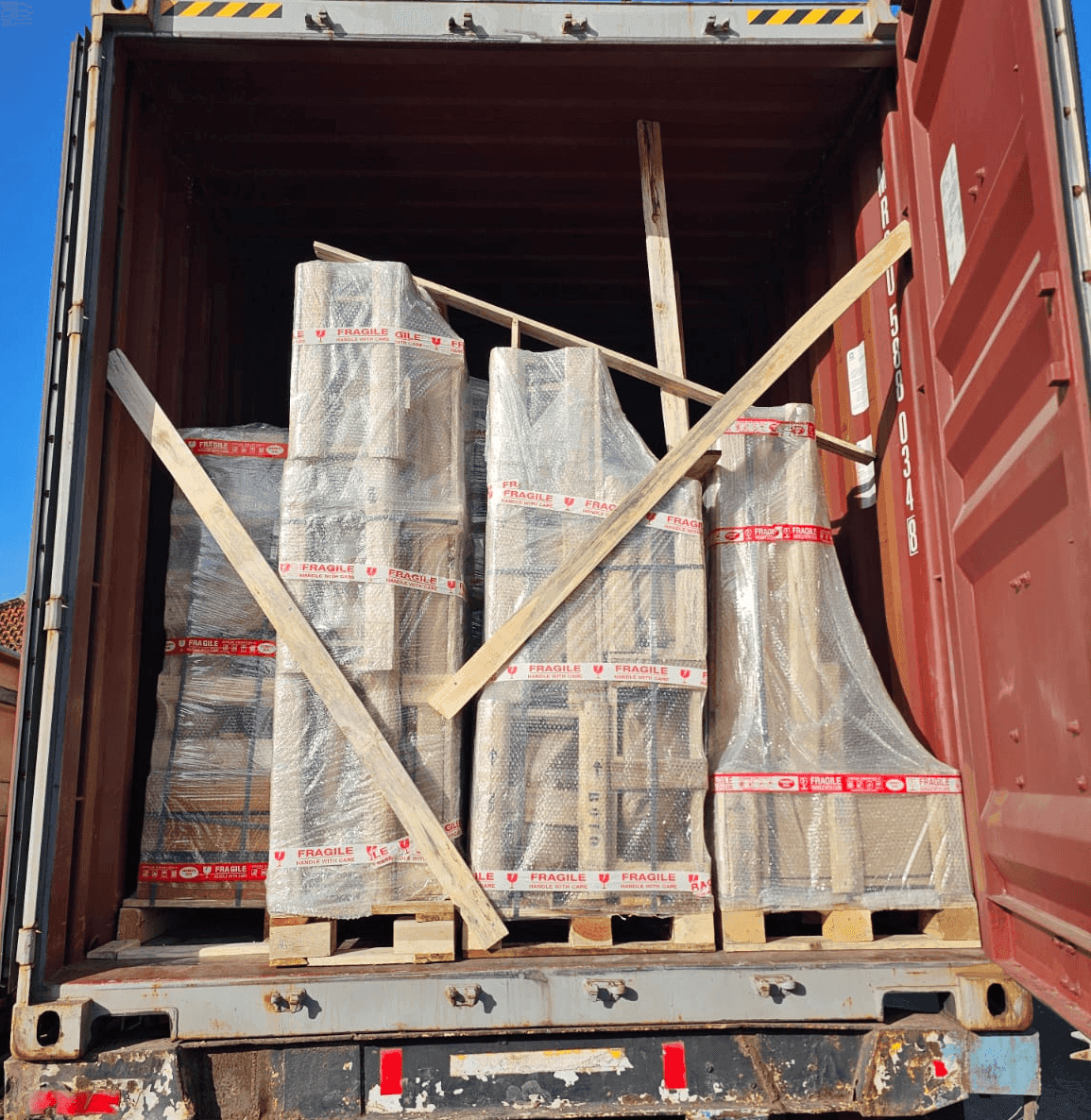 A palletized container: fountains shrink-wrapped and strapped on pallets